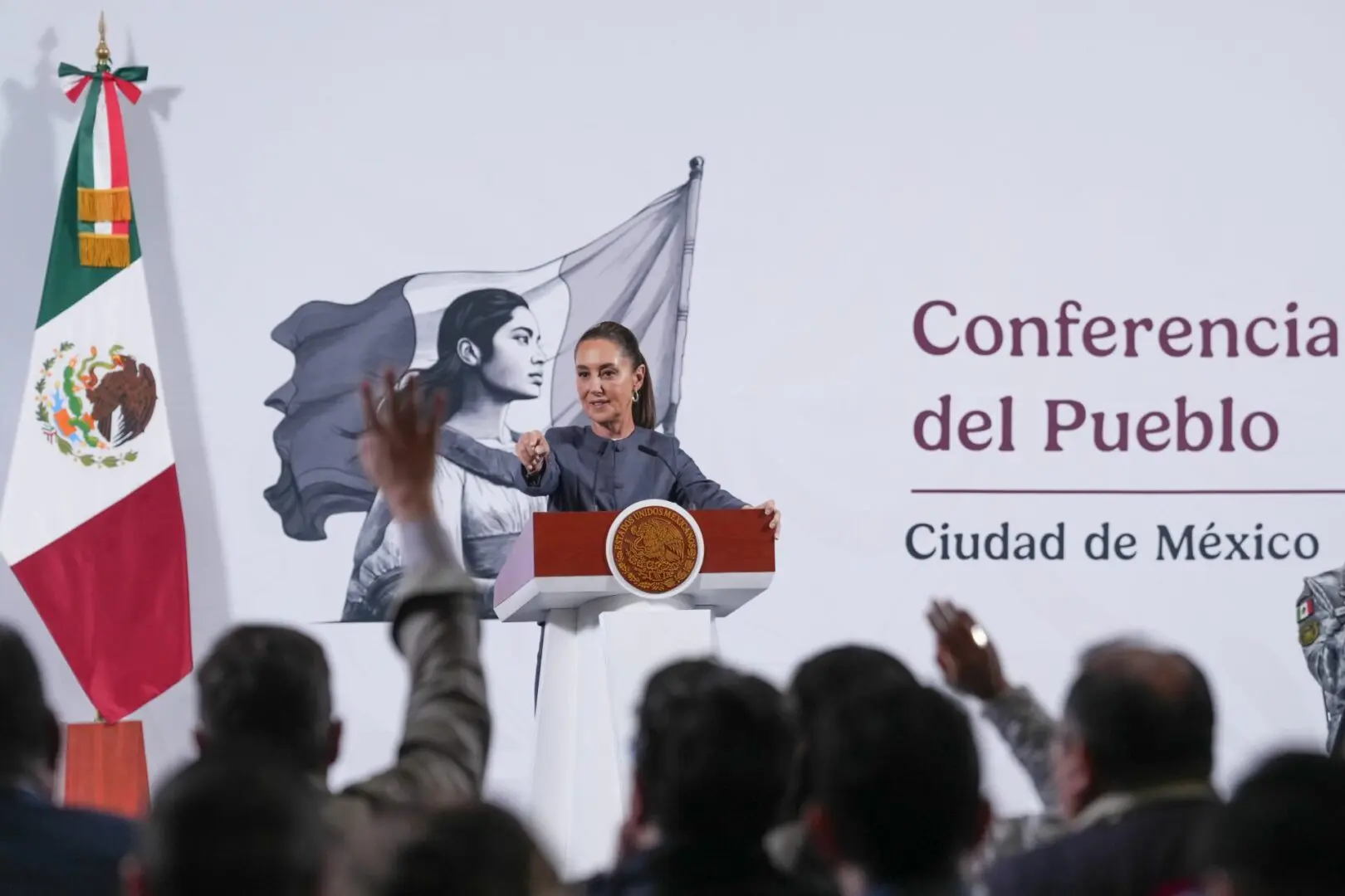 Speaker at podium during Mexico City conference.