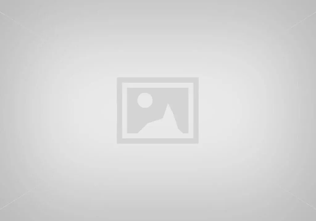 A blank gray background with a faint, subtle gradient.