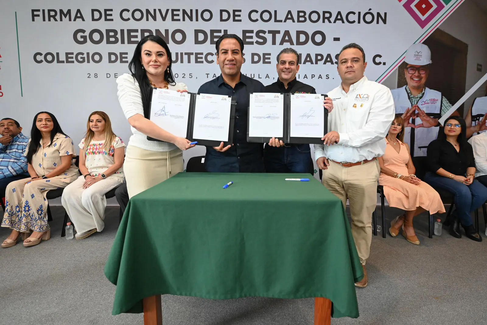 Group holding signed collaboration agreement documents.