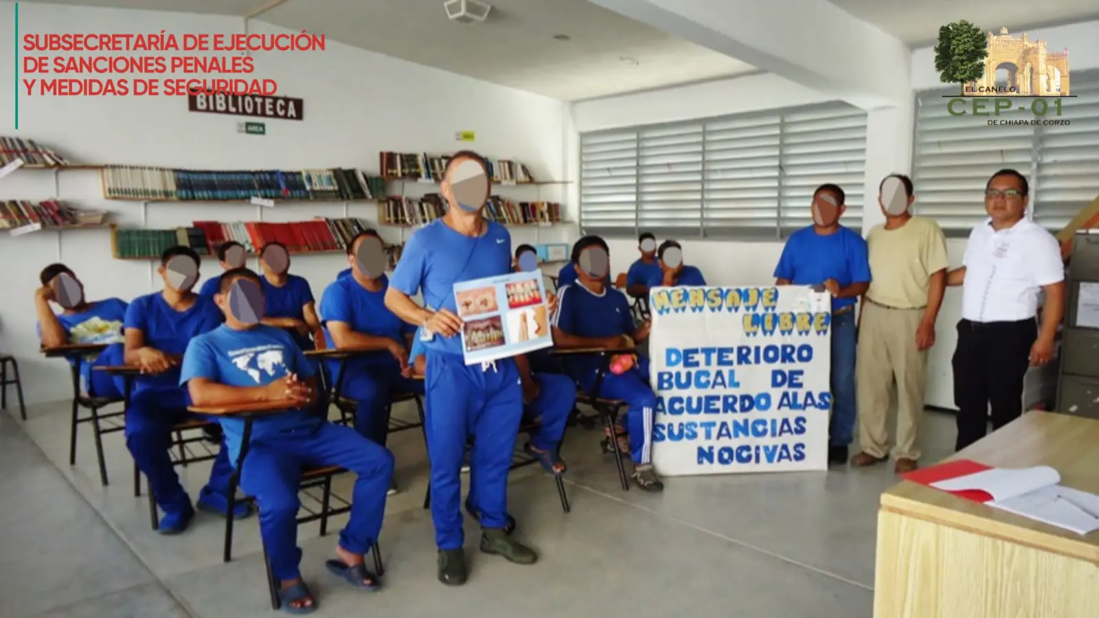 Group in blue uniforms holding dental health banner