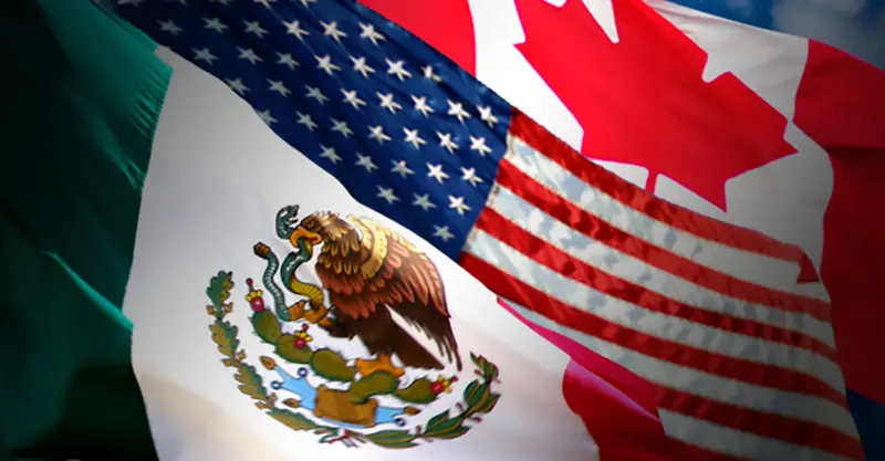 Waving flags of Canada, United States, and Mexico