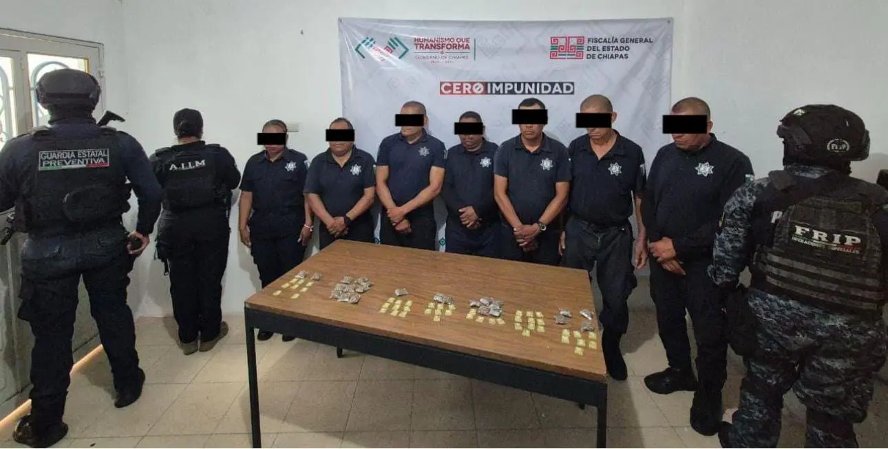 People in uniform standing near a table.