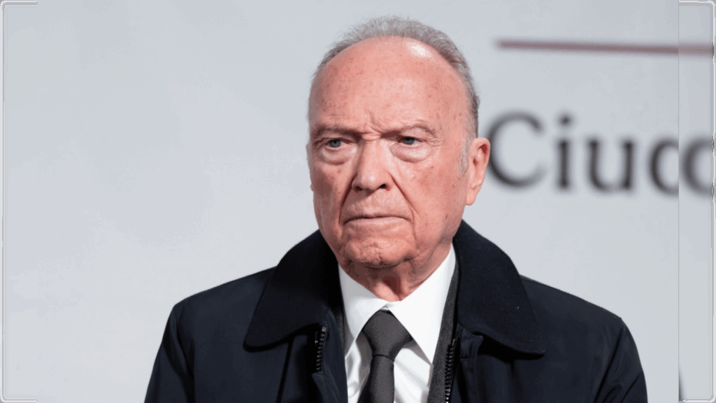 serious older man wearing suit and tie