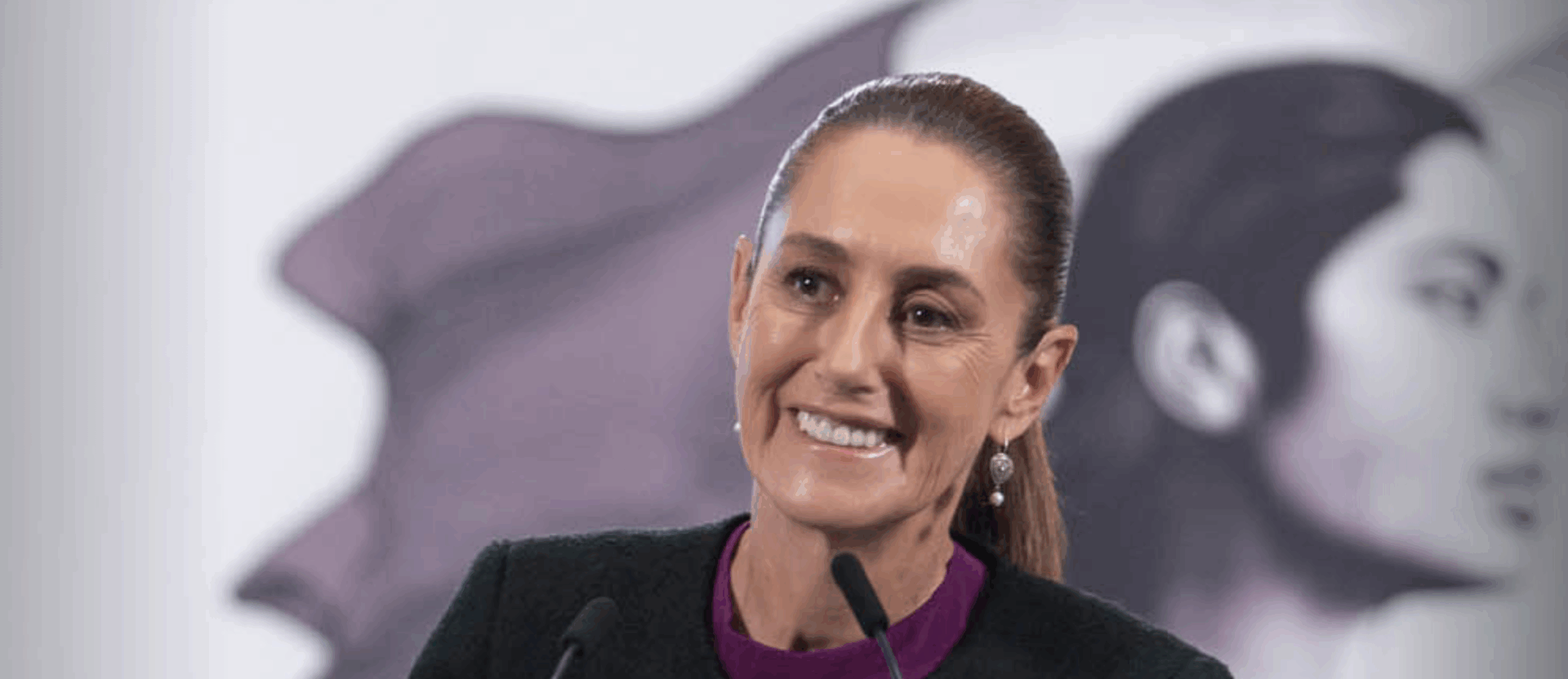 Smiling woman speaking at podium