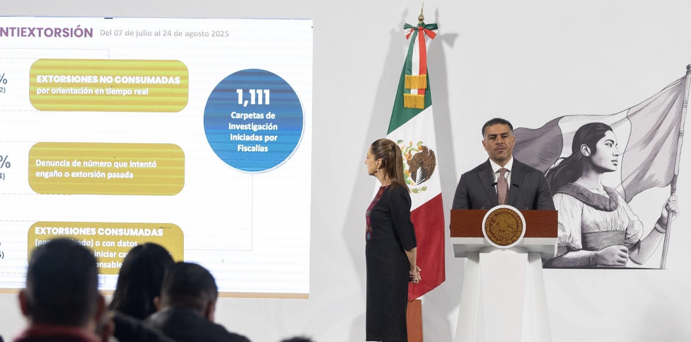 Official at podium with presentation and Mexican flag