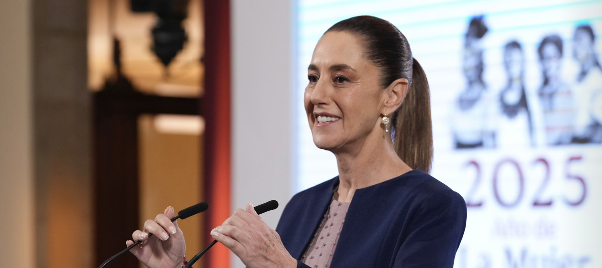 Smiling woman speaking at podium during presentation