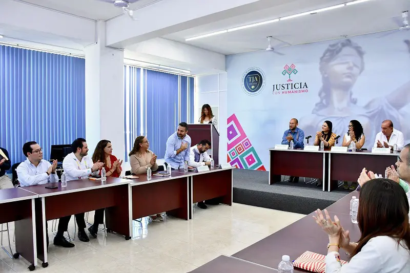 People at a conference table discussion.