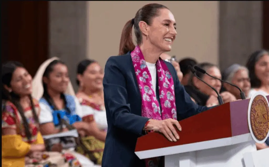 Smiling woman with ponytail and pink scarf