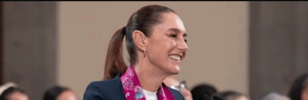 Smiling woman with ponytail and pink scarf