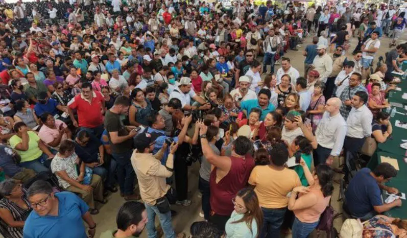 Dense indoor crowd at community event