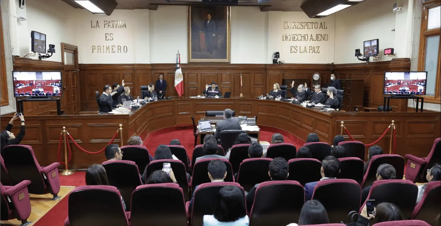 Courtroom session with judges and audience present.