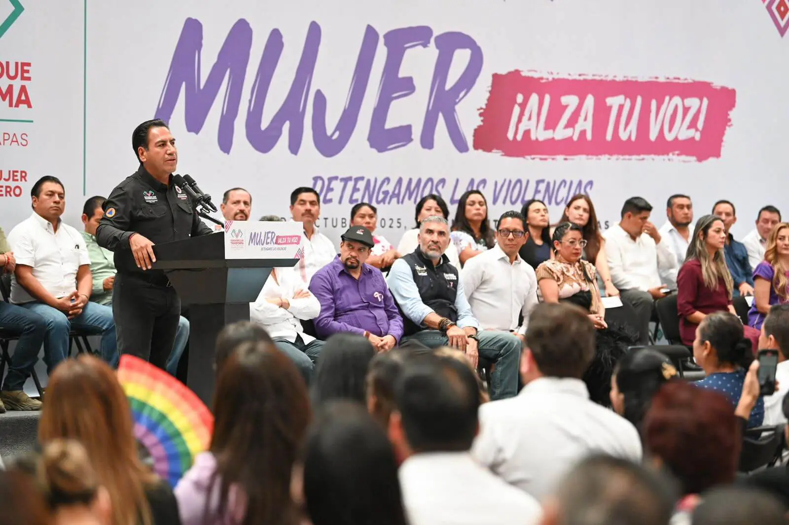 Speaker at women's rights rally with audience