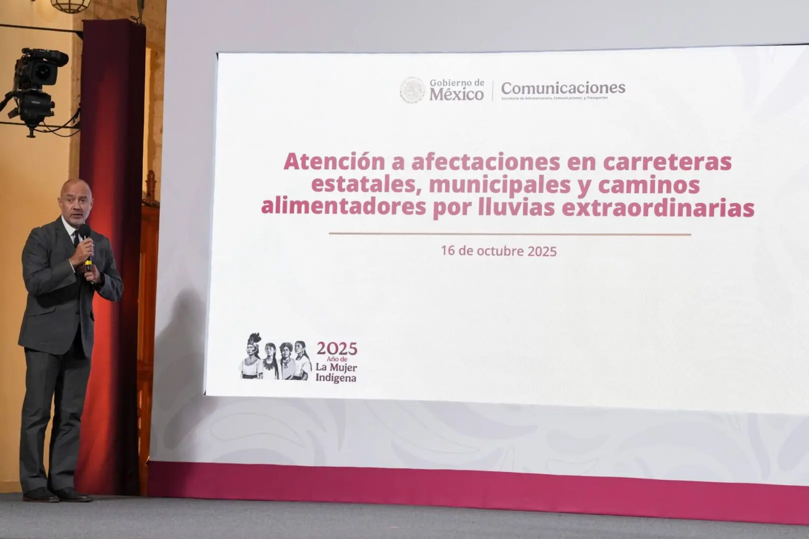 Speaker beside slide about roads affected by rains