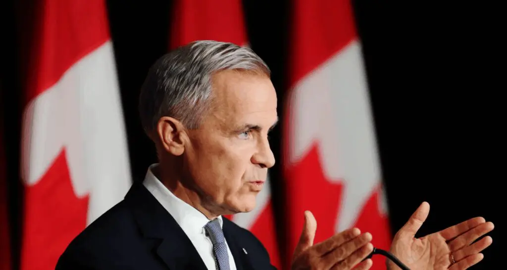 Official delivering speech with Canadian flags