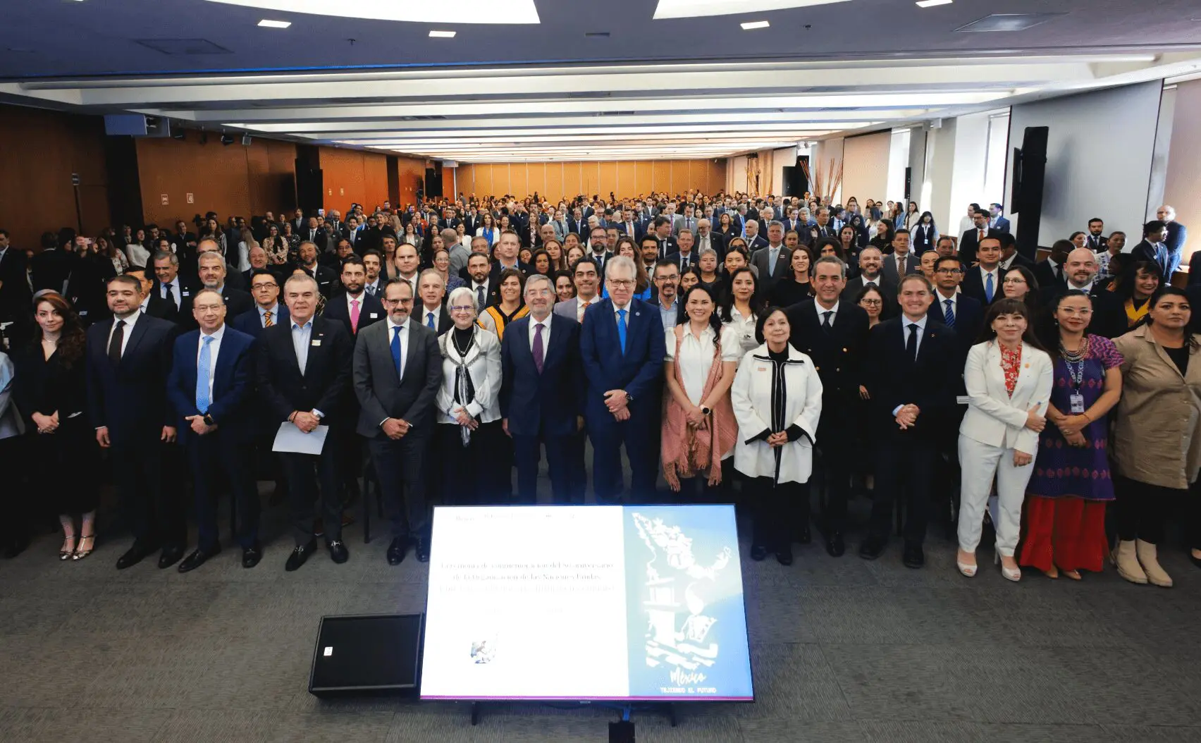 Delegates posing for large conference group photo