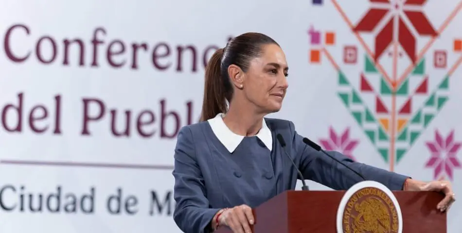 Woman speaking at podium with conference backdrop