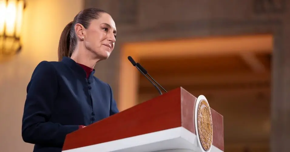 Woman delivering speech at ornate lectern