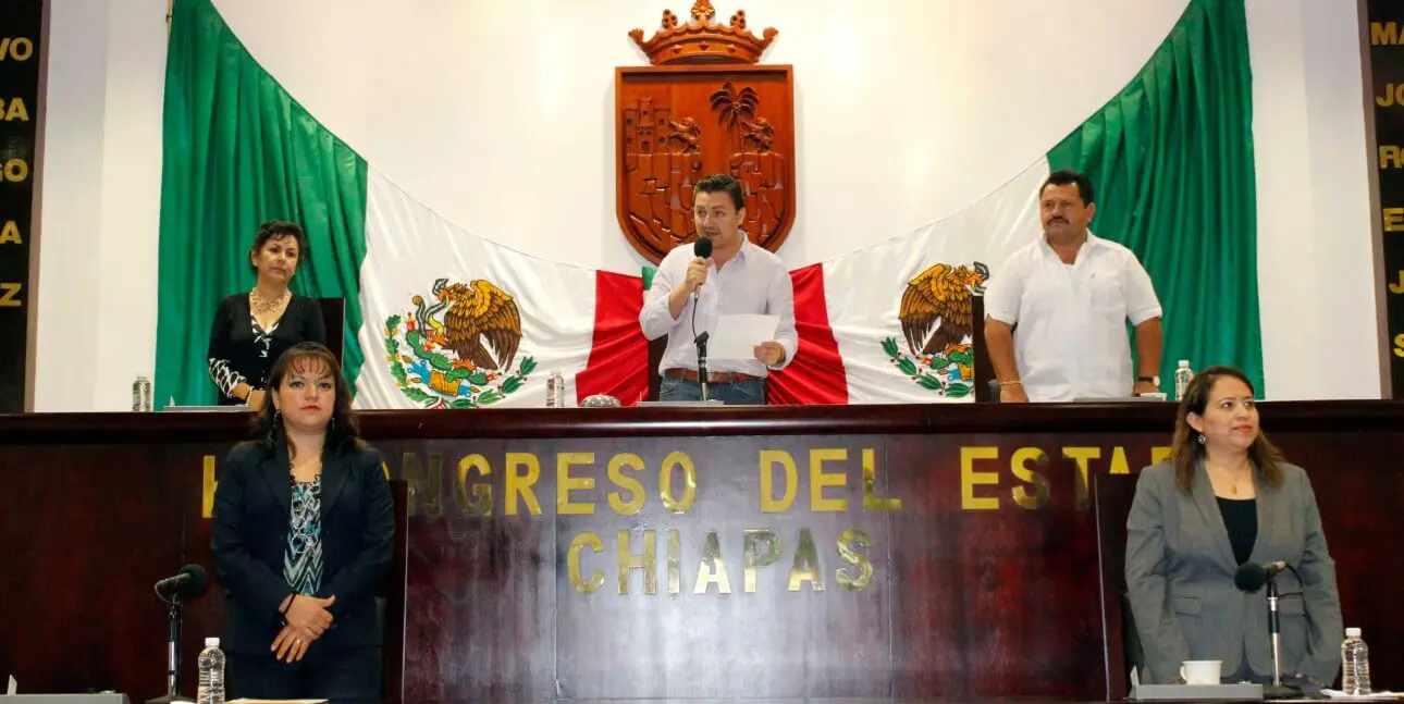 Officials at Chiapas state congress with flag