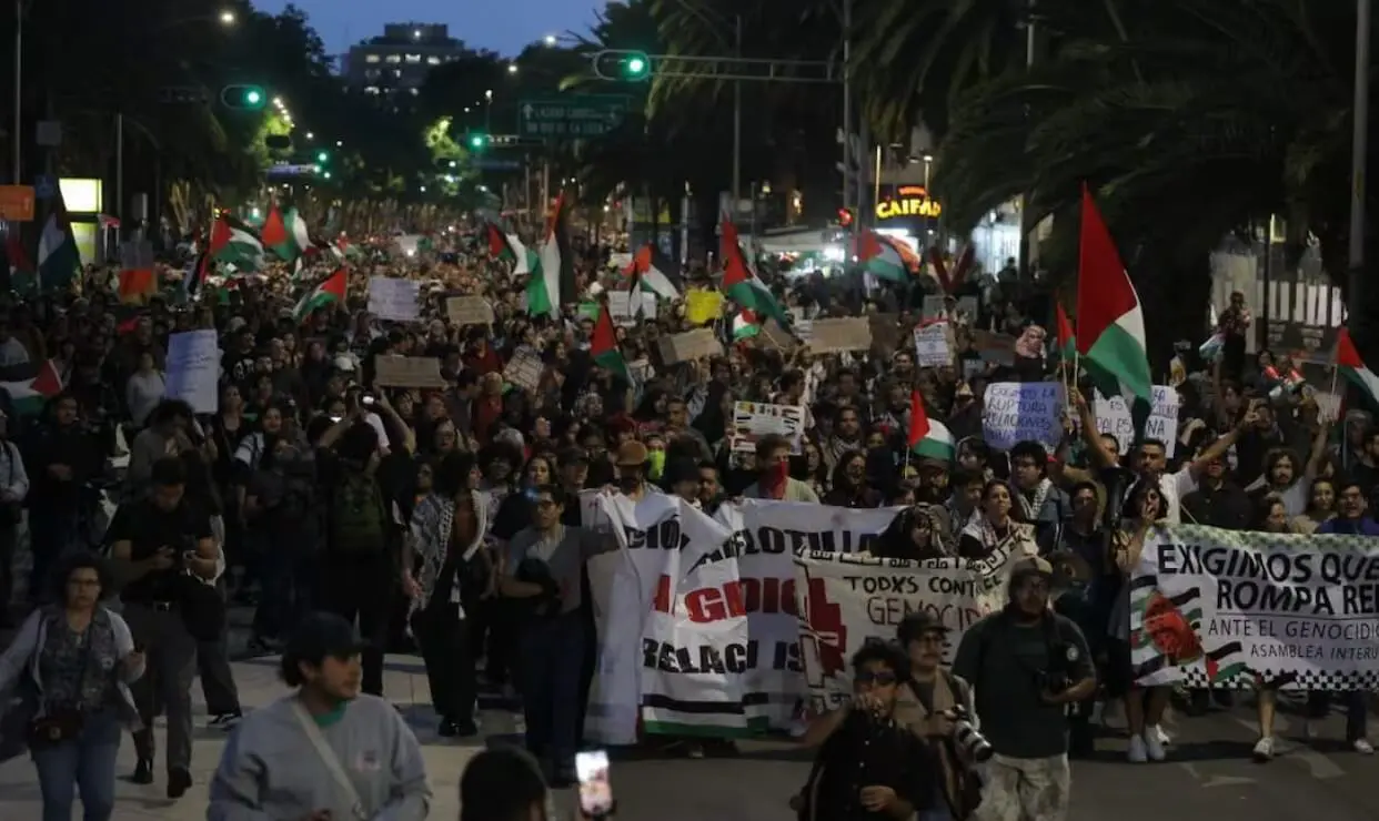 Protesters marching with flags and banners.