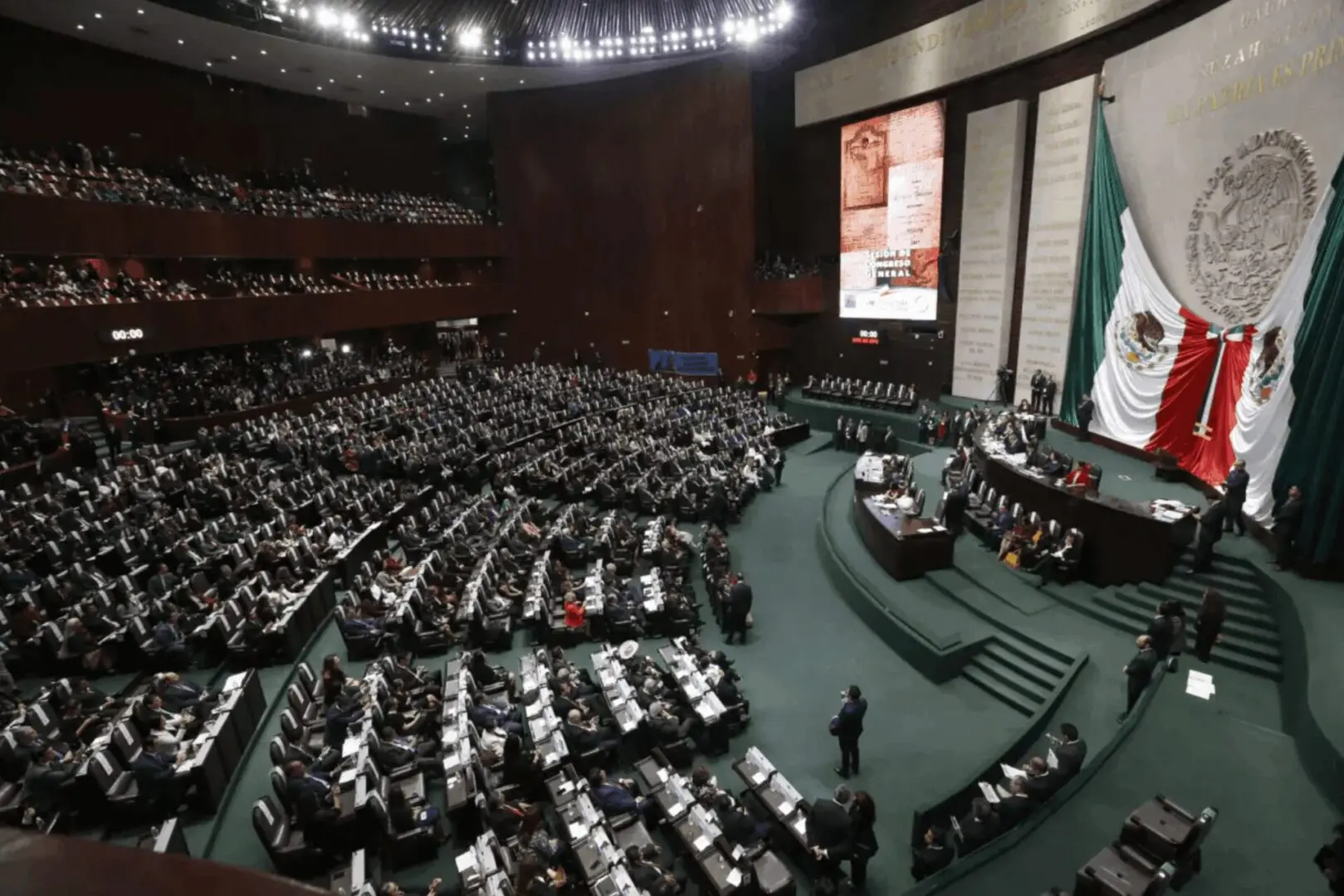 Mexican legislative chamber filled with seated deputies