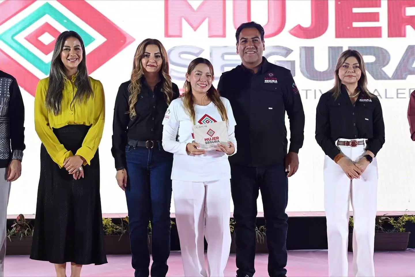 Women's safety award presentation on stage