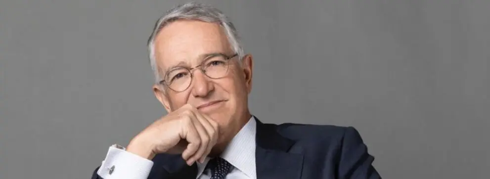 Pensive senior executive in suit and glasses