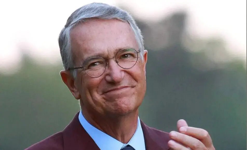 Smiling man with glasses applauding