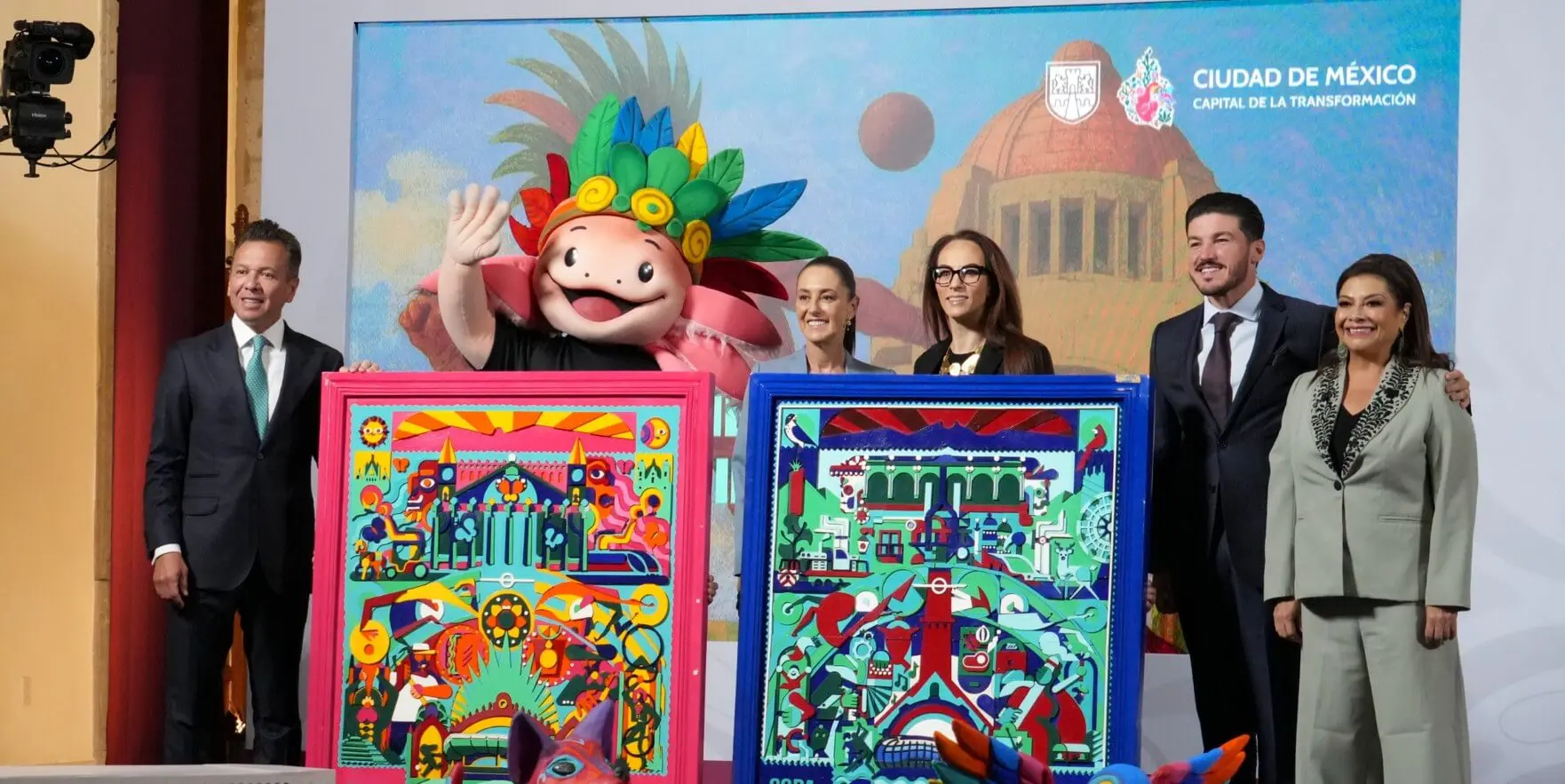Group unveiling vibrant folk-art panels with mascot
