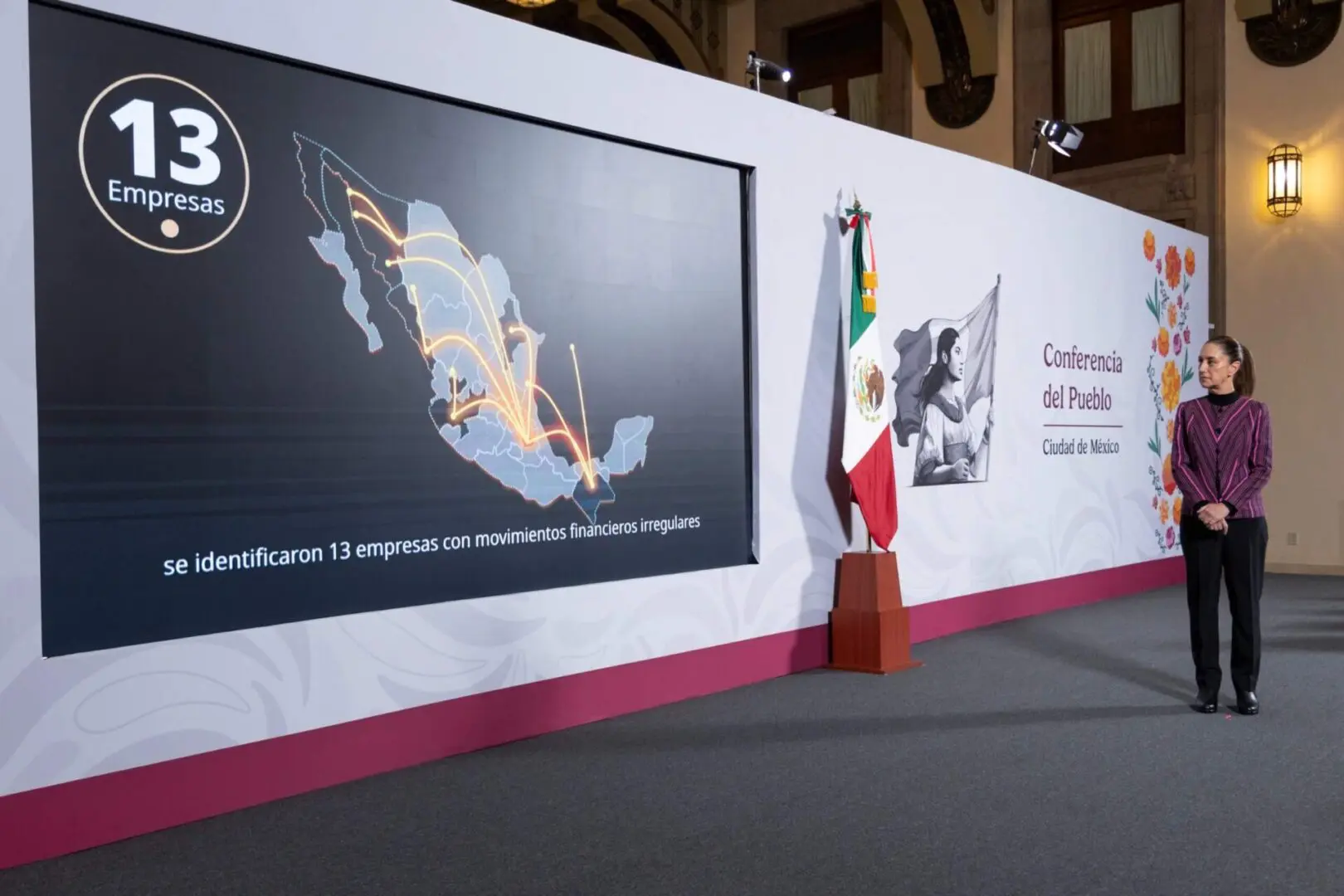 Woman beside Mexican conference map and flag