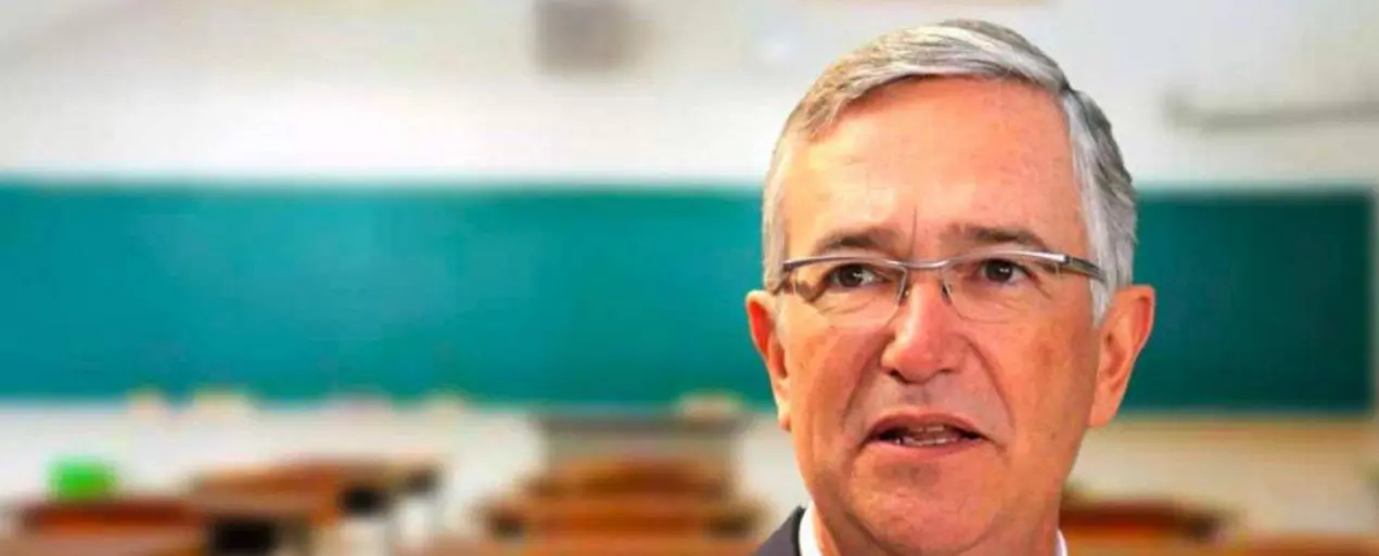 Teacher with glasses in classroom