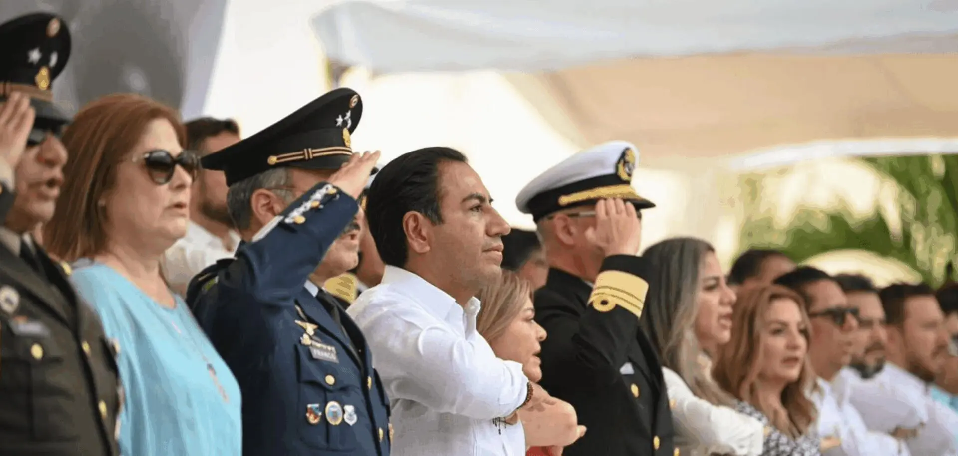 Uniformed officers and civilians saluting