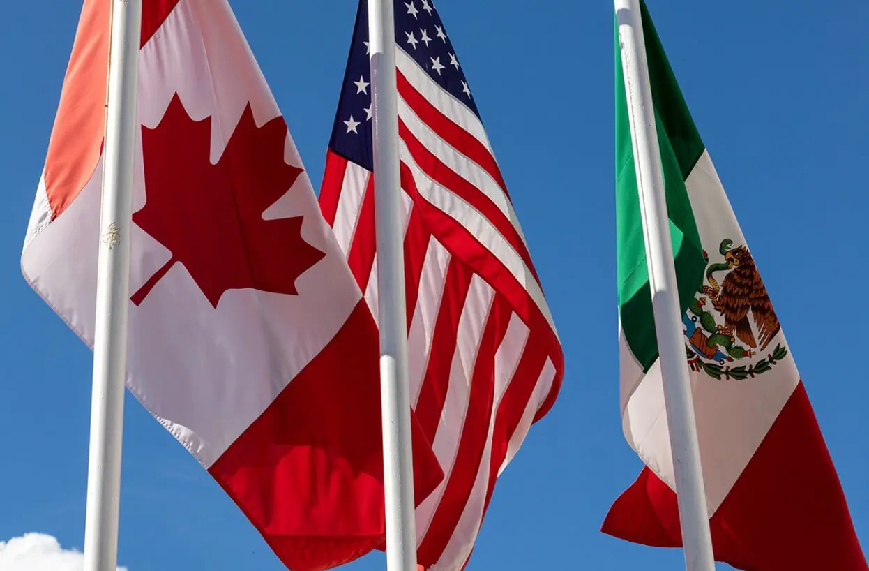 Canadian, American, and Mexican flags fluttering