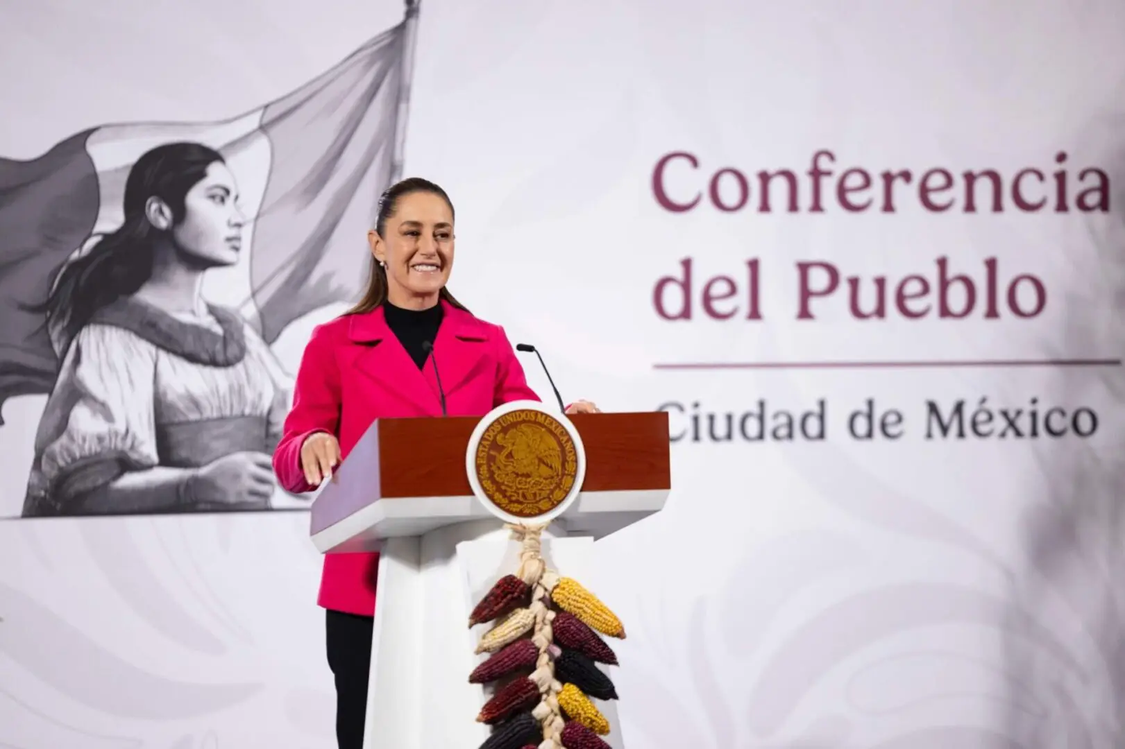 Smiling woman speaking at Mexico City conference