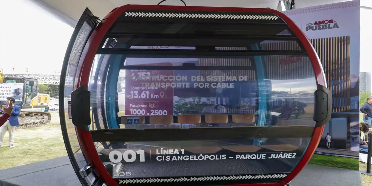 Red cable car display at an exhibition.