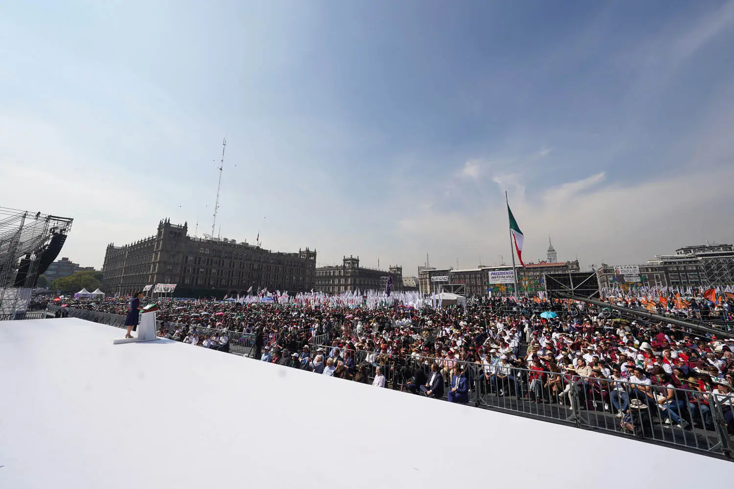 Large crowd gathered in public square event.