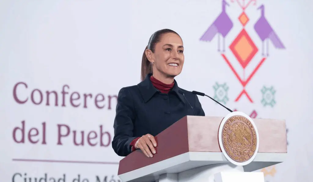Woman holding podium with presidential emblem visible