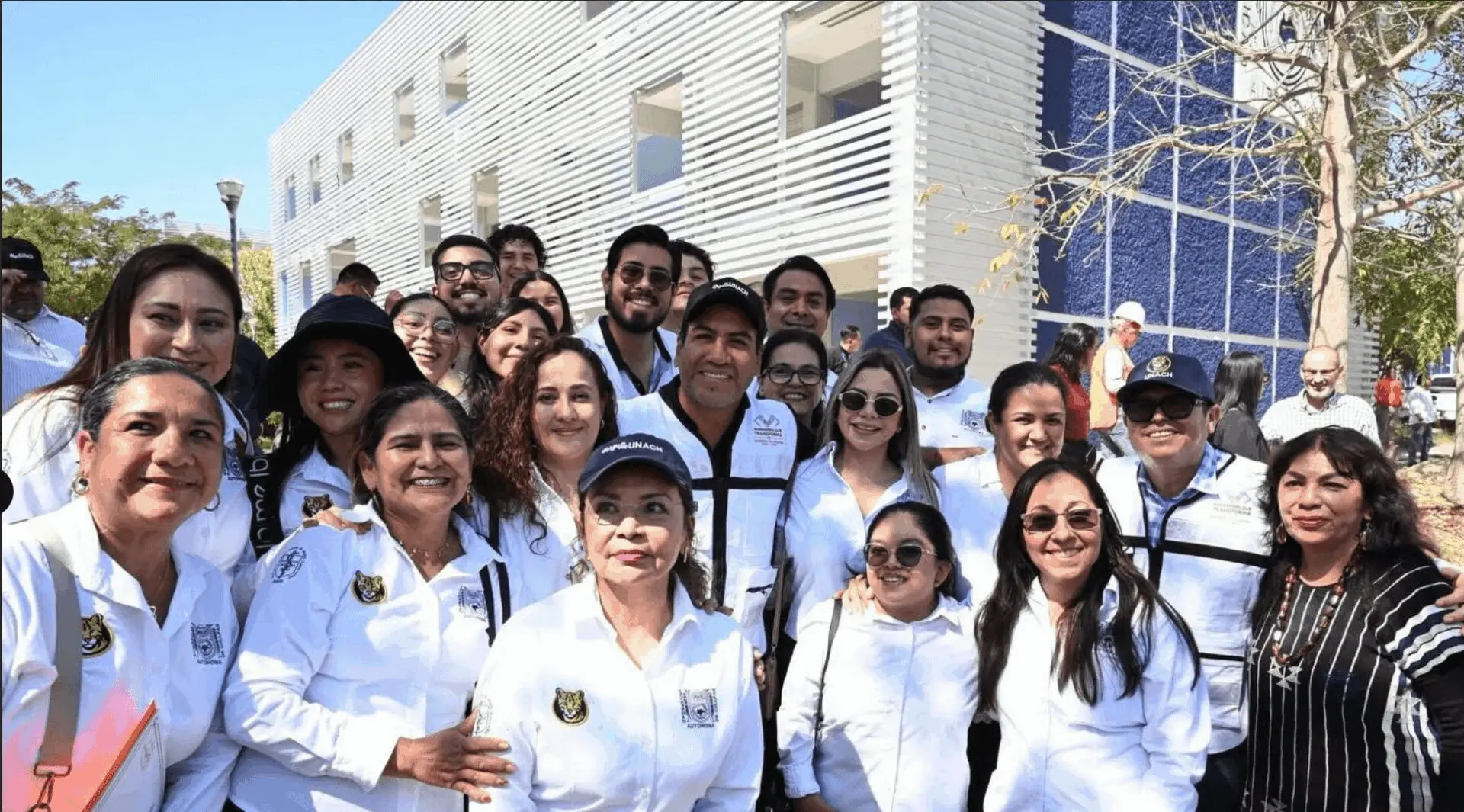 Smiling diverse group wearing white jackets