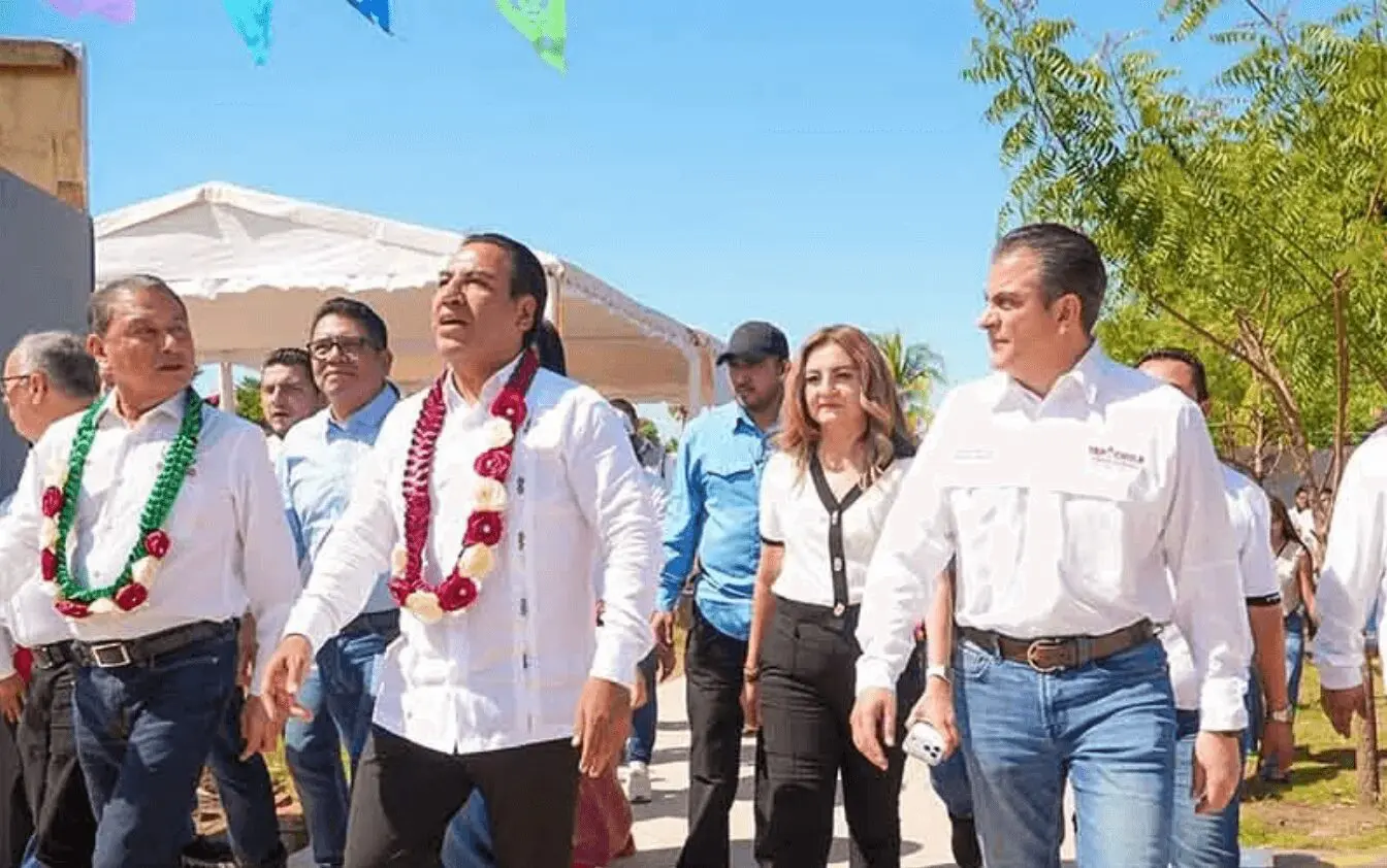 People in white shirts wearing flower garlands