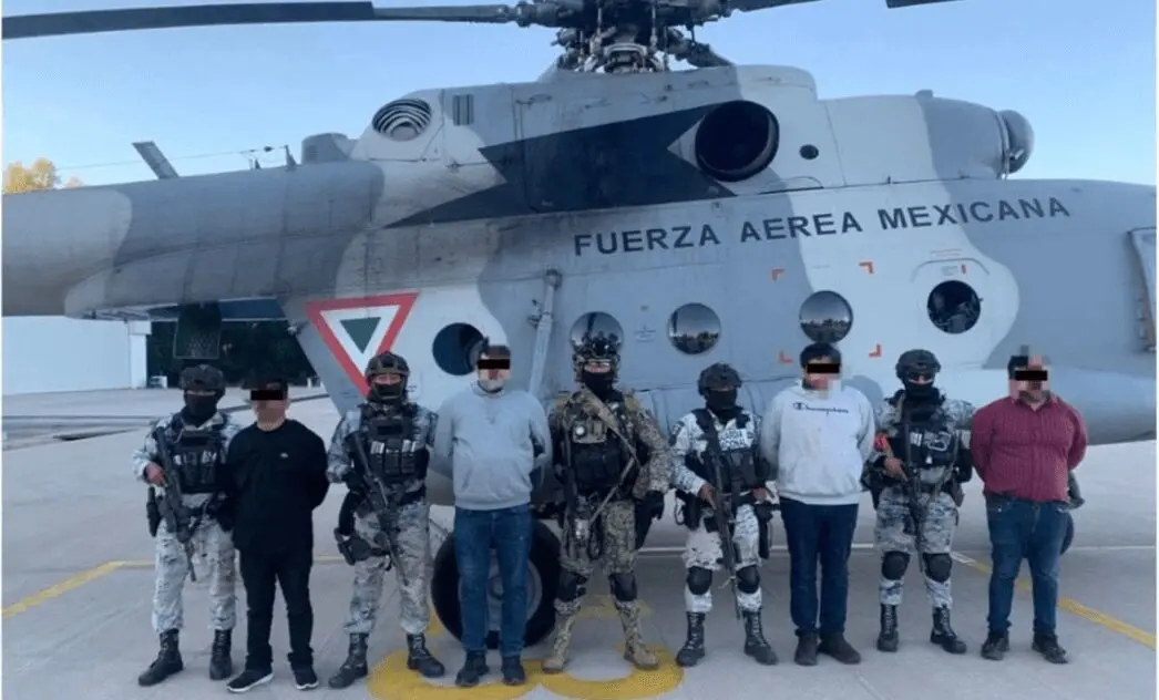 Mexican military helicopter with armed soldiers
