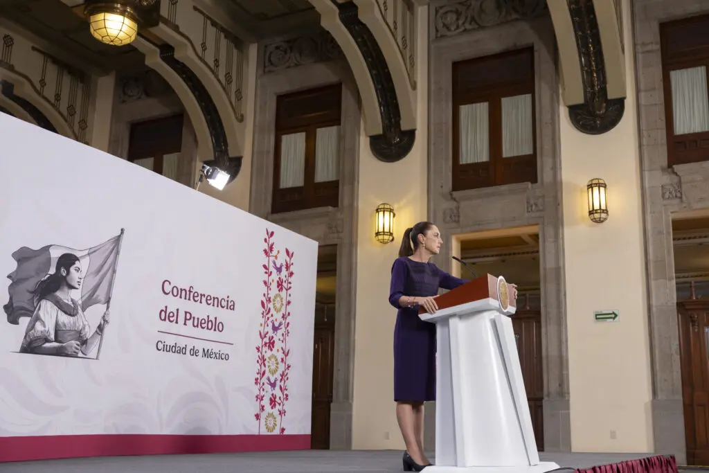 Woman speaking at podium during press conference