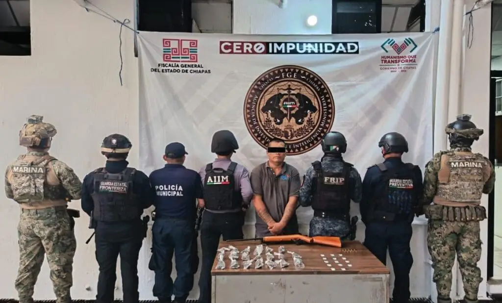 Handcuffed suspect surrounded by armed officers