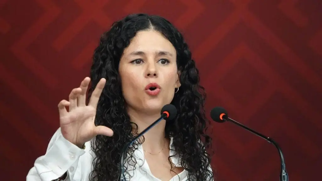 Woman speaking passionately at microphones