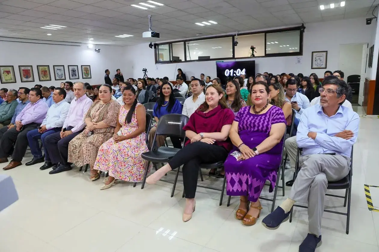 Audience seated in conference room