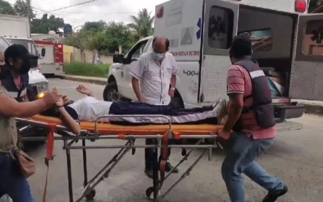 Paramedics loading injured person onto ambulance stretcher