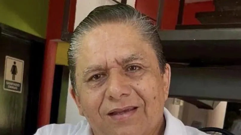 Portrait of older man smiling indoors