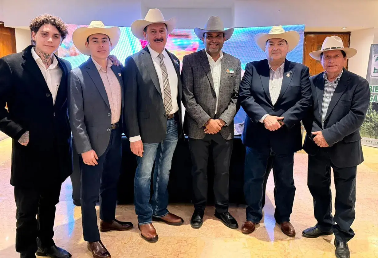 Six men in cowboy hats and suits