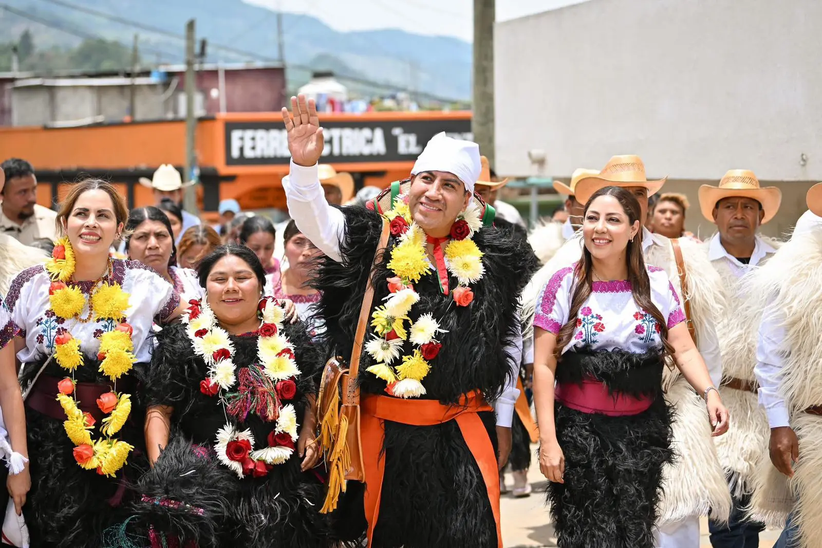 Parade of people in traditional festive Mexican attire