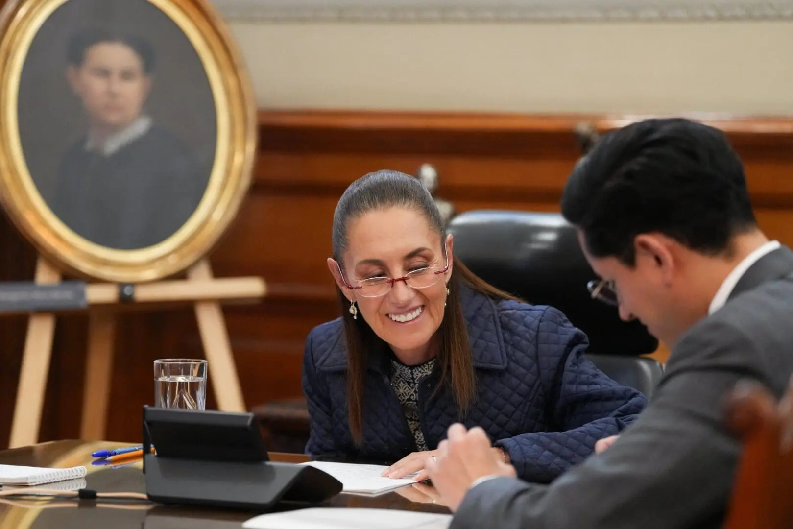 Smiling woman and man reviewing papers