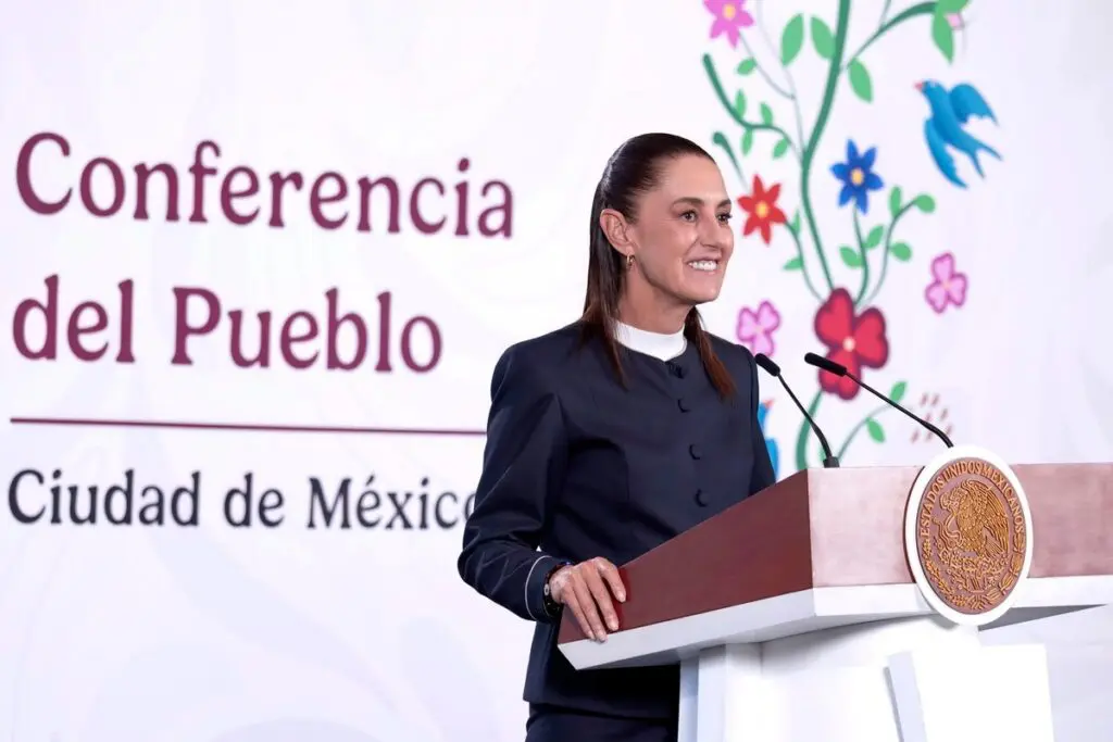 Woman speaking at Mexico City conference podium