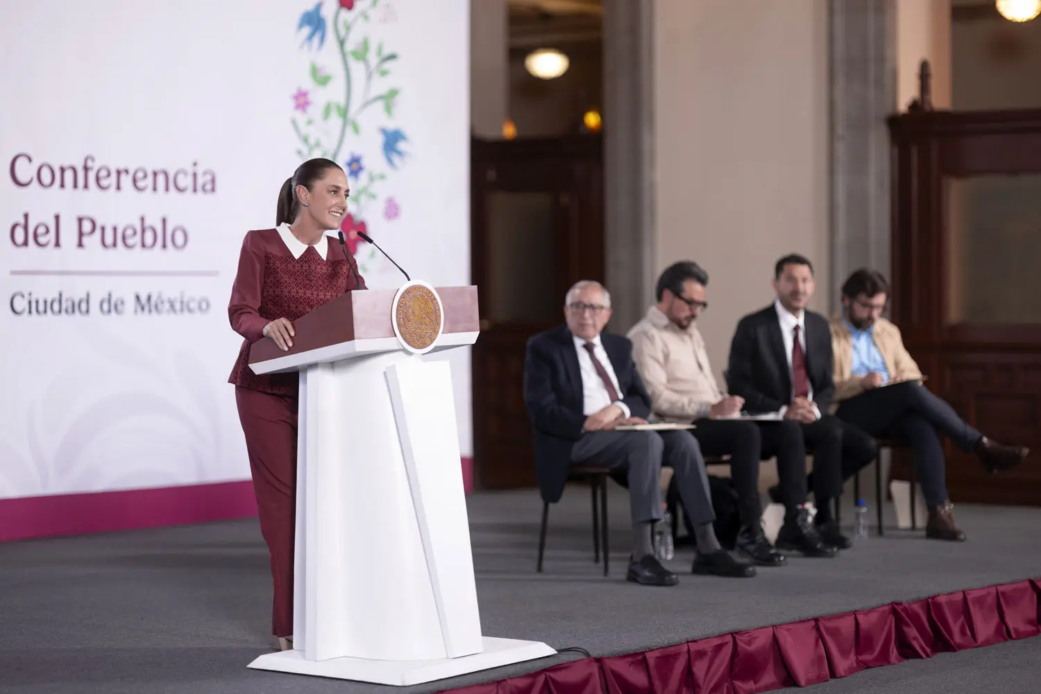Woman speaking at podium at Mexico City conference